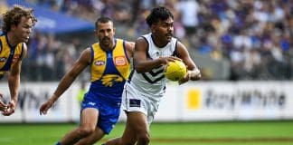 PERTH, AUSTRALIA - MARCH 30: Isaiah Dudley of the Dockers runs with the ball during the 2025 AFL Round 03 match between the West Coast Eagles and the Fremantle Dockers at Optus Stadium on March 30, 2025 in Perth, Australia. (Photo by Daniel Carson/AFL Photos via Getty Images)