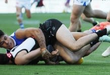 The Paul Curtis tackle on Josh Sinn. Picture: James Elsby/AFL Photos via Getty Images