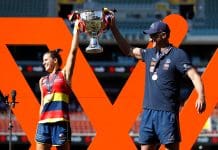 ADELAIDE, AUSTRALIA - APRIL 09: Chelsea Randall of the Crows and Matthew Clarke, Senior Coach of the Crows lift up the premiership cup during the 2022 AFLW Grand Final match between the Adelaide Crows and the Melbourne Demons at Adelaide Oval on April 09, 2022 in Adelaide, Australia. (Photo by Dylan Burns/AFL Photos via Getty Images)