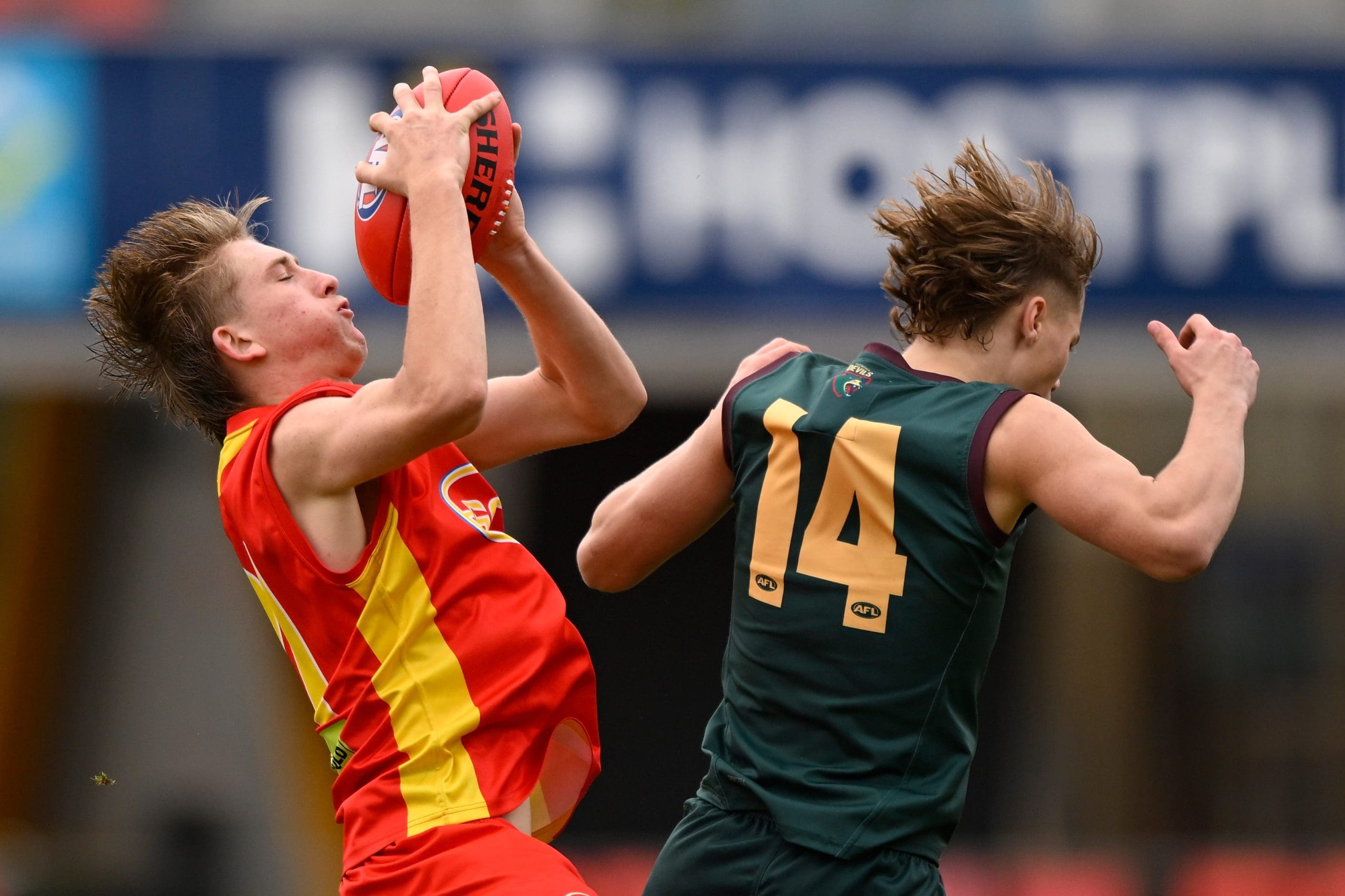 GOLD COAST, AUSTRALIA - JULY 03: Cooper Collins of Gold Coast competes for the ball against Rylee McHenry of Tasmania during the AFL National Development Championships U16 boys match between Gold Coast Suns and Tasmania at Heritage Bank Stadium on July 03, 2023 in Gold Coast, Australia. (Photo by Matt Roberts/AFL Photos/Getty Images)