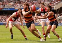 ADELAIDE, AUSTRALIA - MARCH 16: Zaine Cordy of the Saints tackles Riley Thilthorpe of the Crows during the 2025 AFL Round 01 match between the Adelaide Crows and the St Kilda Saints at Adelaide Oval on March 16, 2025 in Adelaide, Australia. (Photo by James Elsby/AFL Photos via Getty Images)