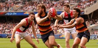 ADELAIDE, AUSTRALIA - MARCH 16: Zaine Cordy of the Saints tackles Riley Thilthorpe of the Crows during the 2025 AFL Round 01 match between the Adelaide Crows and the St Kilda Saints at Adelaide Oval on March 16, 2025 in Adelaide, Australia. (Photo by James Elsby/AFL Photos via Getty Images)