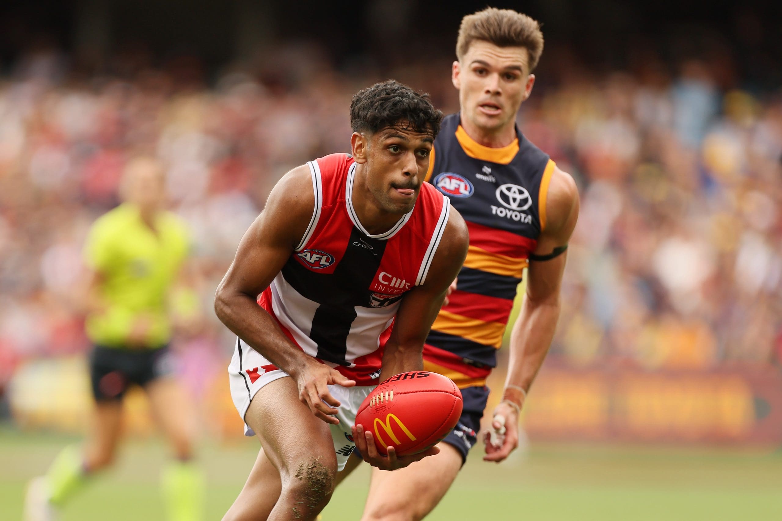 ADELAIDE, AUSTRALIA - MARCH 16: Nasiah Wanganeen-Milera of the Saints is tackled by Ben Keays of the Crows during the 2025 AFL Round 01 match between the Adelaide Crows and the St Kilda Saints at Adelaide Oval on March 16, 2025 in Adelaide, Australia. (Photo by James Elsby/AFL Photos via Getty Images)