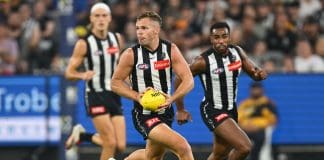MELBOURNE, AUSTRALIA - MARCH 15: Dan Houston of the Magpies looks to pass the ball during the round one AFL match between Collingwood Magpies and Port Adelaide Power at Melbourne Cricket Ground, on March 15, 2025, in Melbourne, Australia. (Photo by Quinn Rooney/Getty Images)