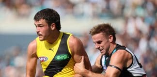 ADELAIDE, AUSTRALIA - MARCH 22: Harry Armstrong of the Tigers is tackled by Jackson Mead of the Power during the 2025 AFL Round 02 match between the Port Adelaide Power and the Richmond Tigers at Adelaide Oval on March 22, 2025 in Adelaide, Australia. (Photo by James Elsby/AFL Photos via Getty Images)