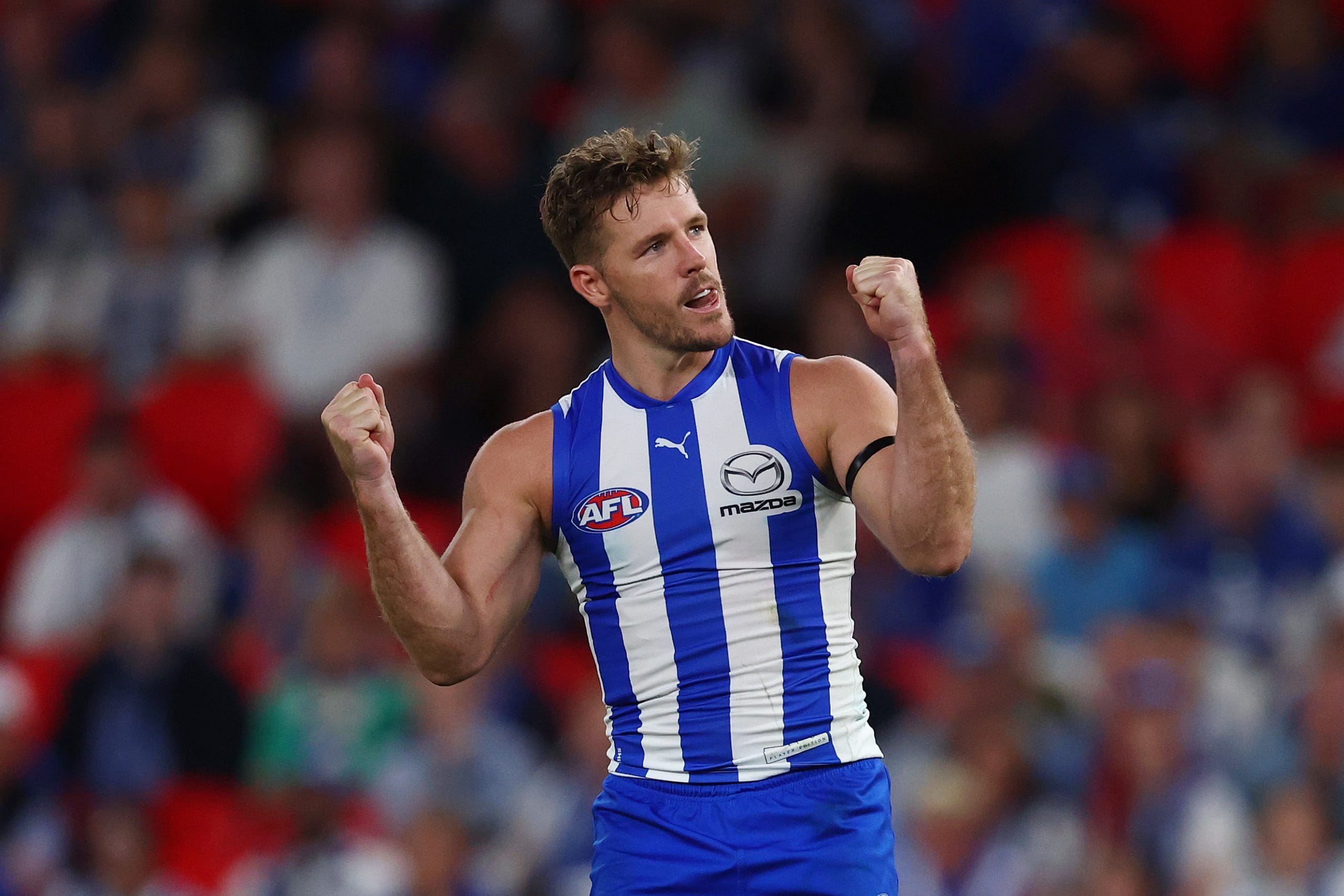 MELBOURNE, AUSTRALIA - MARCH 23: Luke Parker of the Kangaroos celebrates a goal during the round two AFL match between North Melbourne Kangaroos and Melbourne Demons at Marvel Stadium, on March 23, 2025, in Melbourne, Australia. (Photo by Morgan Hancock/Getty Images)