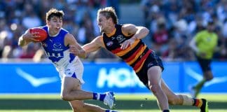 ADELAIDE, AUSTRALIA - MARCH 30: Finn O'Sullivan of the Kangaroos  competes with  Jordan Dawson of the Crows during the round three AFL match between Adelaide Crows and North Melbourne Kangaroos at Adelaide Oval, on March 30, 2025, in Adelaide, Australia. (Photo by Mark Brake/Getty Images)