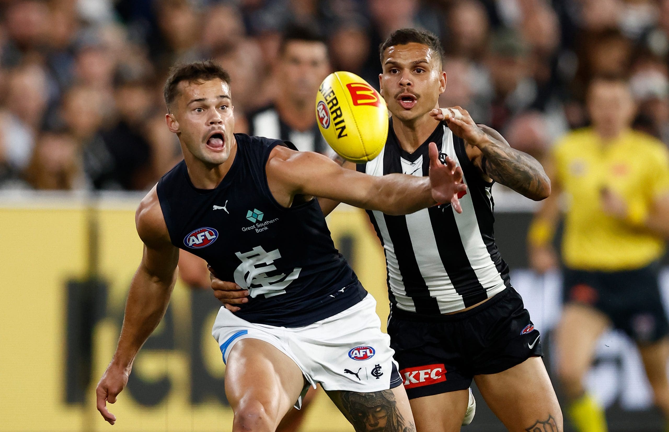 MELBOURNE, AUSTRALIA - APRIL 03: Lachlan Cowan of the Blues and Bobby Hill of the Magpies in action during the 2025 AFL Round 04 match between the Collingwood Magpies and the Carlton Blues at the Melbourne Cricket Ground on April 3, 2025 in Melbourne, Australia. (Photo by Michael Willson/AFL Photos via Getty Images)