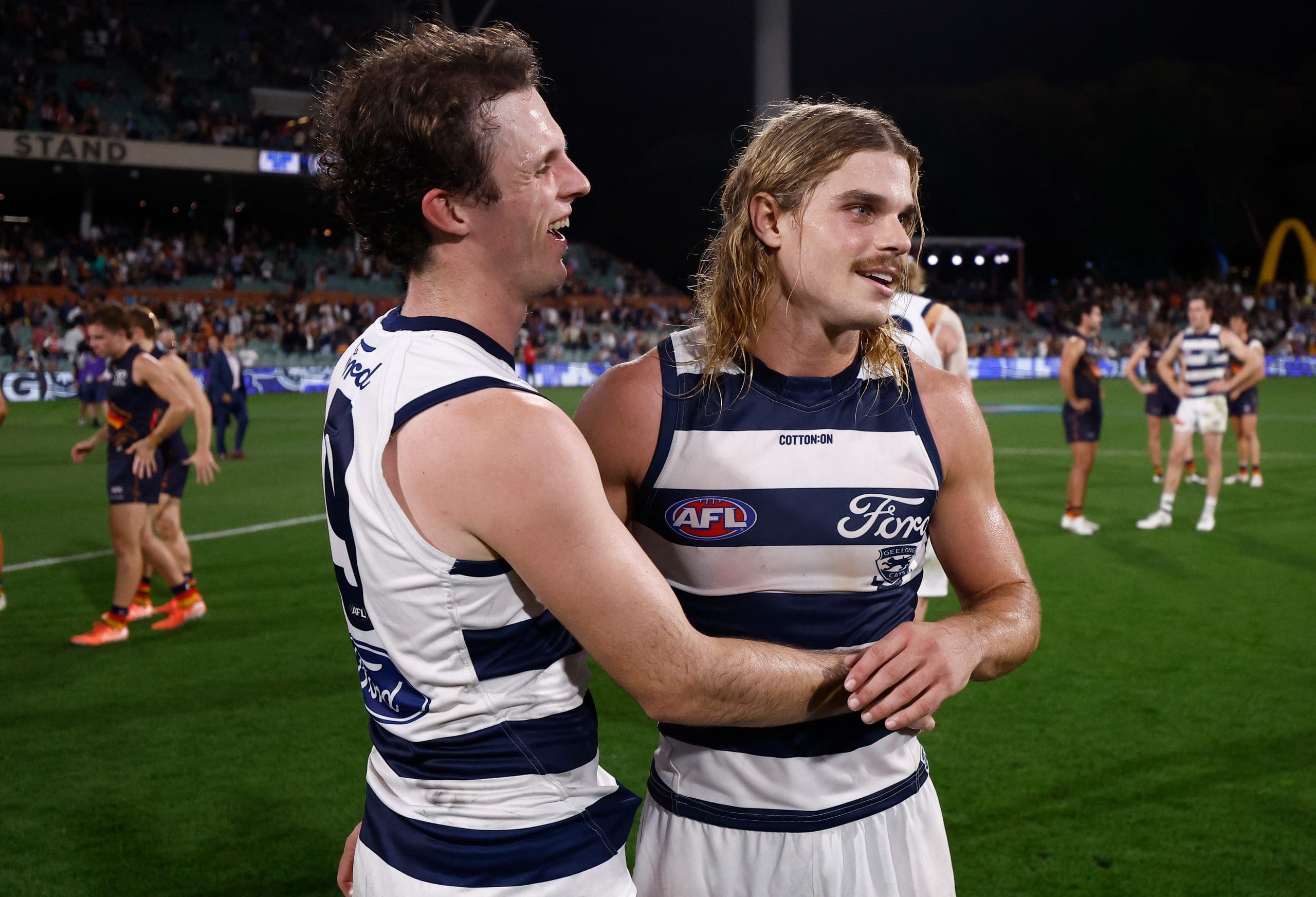 ADELAIDE, AUSTRALIA - APRIL 10: Max Holmes (left) and Bailey Smith of the Cats celebrate during the 2025 AFL Round 05 match between the Adelaide Crows and the Geelong Cats at Adelaide Oval on April 10, 2025 in Adelaide, Australia. (Photo by Michael Willson/AFL Photos via Getty Images)