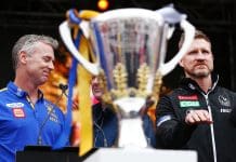 MELBOURNE, AUSTRALIA - SEPTEMBER 28:  Eagles head coach Adam Simpson reacts as Magpies head coach Nathan Buckley asks Magpies fans to calm during the 2018 AFL Grand Final Parade on September 28, 2018 in Melbourne, Australia.  (Photo by Michael Dodge/Getty Images)