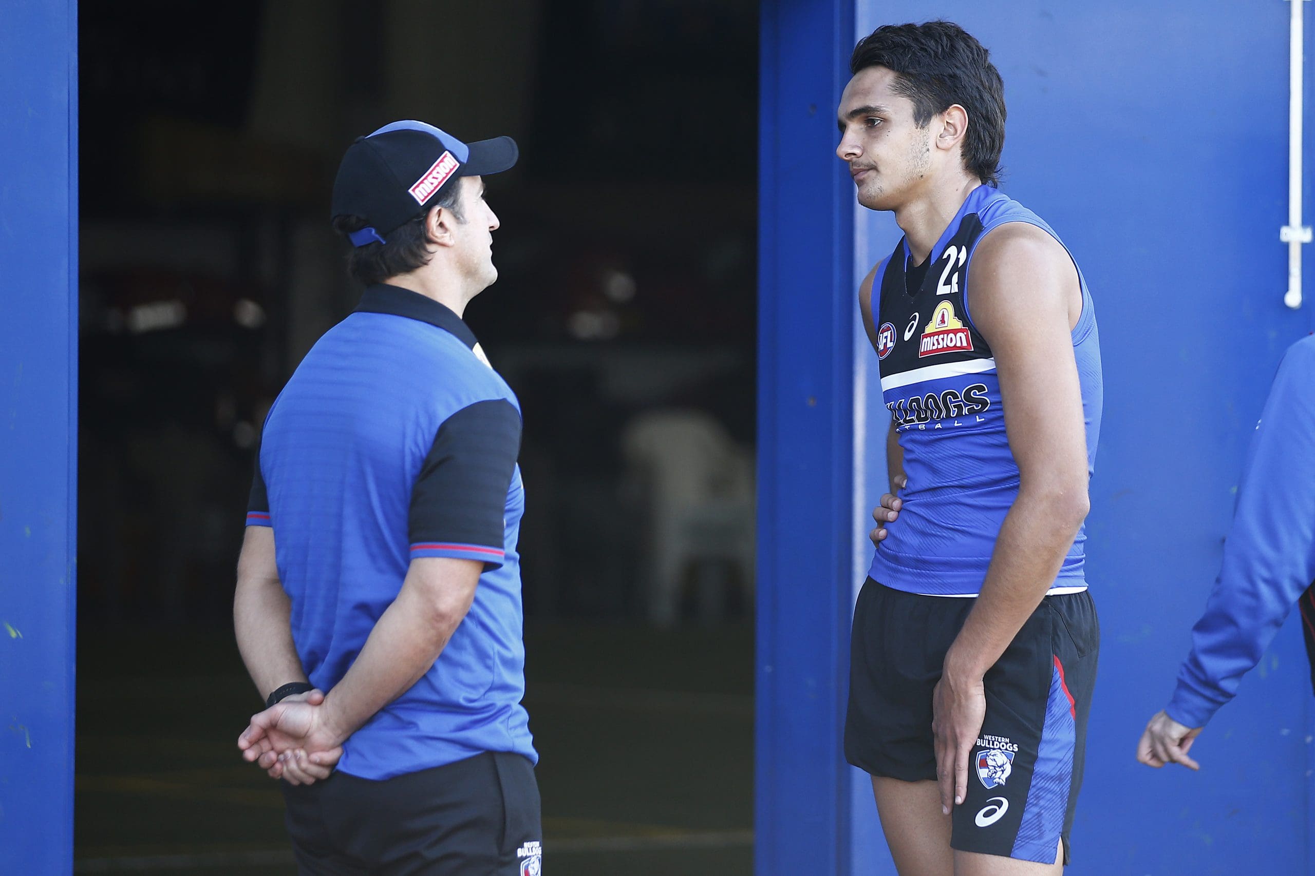 MELBOURNE, AUSTRALIA - APRIL 29: Bulldogs head coach Luke Beveridge (L) speaks with Jamarra Ugle-Hagan of the Bulldogs during a Western Bulldogs AFL training session at Whitten Oval on April 29, 2021 in Melbourne, Australia. (Photo by Daniel Pockett/Getty Images)