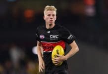 MELBOURNE, AUSTRALIA - MARCH 29: Tobie Travaglia of the Saints warms up ahead of the round three AFL match between St Kilda Saints and Richmond Tigers at Marvel Stadium, on March 29, 2025, in Melbourne, Australia. (Photo by Morgan Hancock/AFL Photos/via Getty Images)