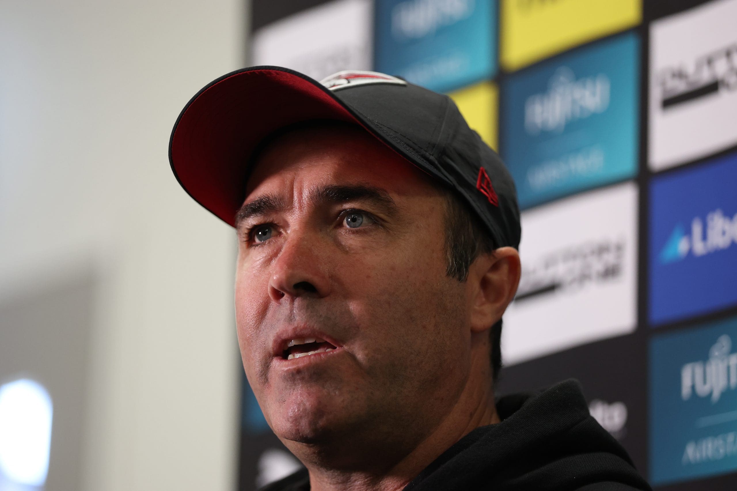 MELBOURNE, AUSTRALIA - APRIL 09: Bombers coach Brad Scott speaks to the media during an Essendon Bombers AFL training session at The Hangar on April 09, 2025 in Melbourne, Australia. (Photo by Robert Cianflone/Getty Images)