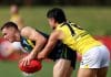 MELBOURNE, AUSTRALIA - APRIL 13: Thomas Burton of the AFL National Academy is tackled during the Marsh AFL National Academy Boys match between Australia U18 and Richmond VFL at RSEA Park on April 13, 2025 in Melbourne, Australia. (Photo by Josh Chadwick/AFL Photos/via Getty Images)