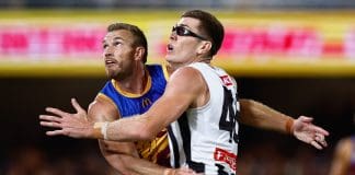 BRISBANE, AUSTRALIA - APRIL 17: Sam Day of the Lions and Mason Cox of the Magpies compete for the ball during the 2025 AFL Round 06 match between the Brisbane Lions and the Collingwood Magpies at The Gabba on April 17, 2025 in Brisbane, Australia. (Photo by Russell Freeman/AFL Photos via Getty Images)
