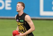 MELBOURNE, AUSTRALIA - APRIL 16: Thomas Sims of the Tigers runs with the ball during a Richmond Tigers AFL training session at Punt Road Oval on April 16, 2025 in Melbourne, Australia. (Photo by Robert Cianflone/Getty Images)