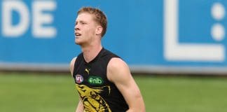 MELBOURNE, AUSTRALIA - APRIL 16: Thomas Sims of the Tigers runs with the ball during a Richmond Tigers AFL training session at Punt Road Oval on April 16, 2025 in Melbourne, Australia. (Photo by Robert Cianflone/Getty Images)