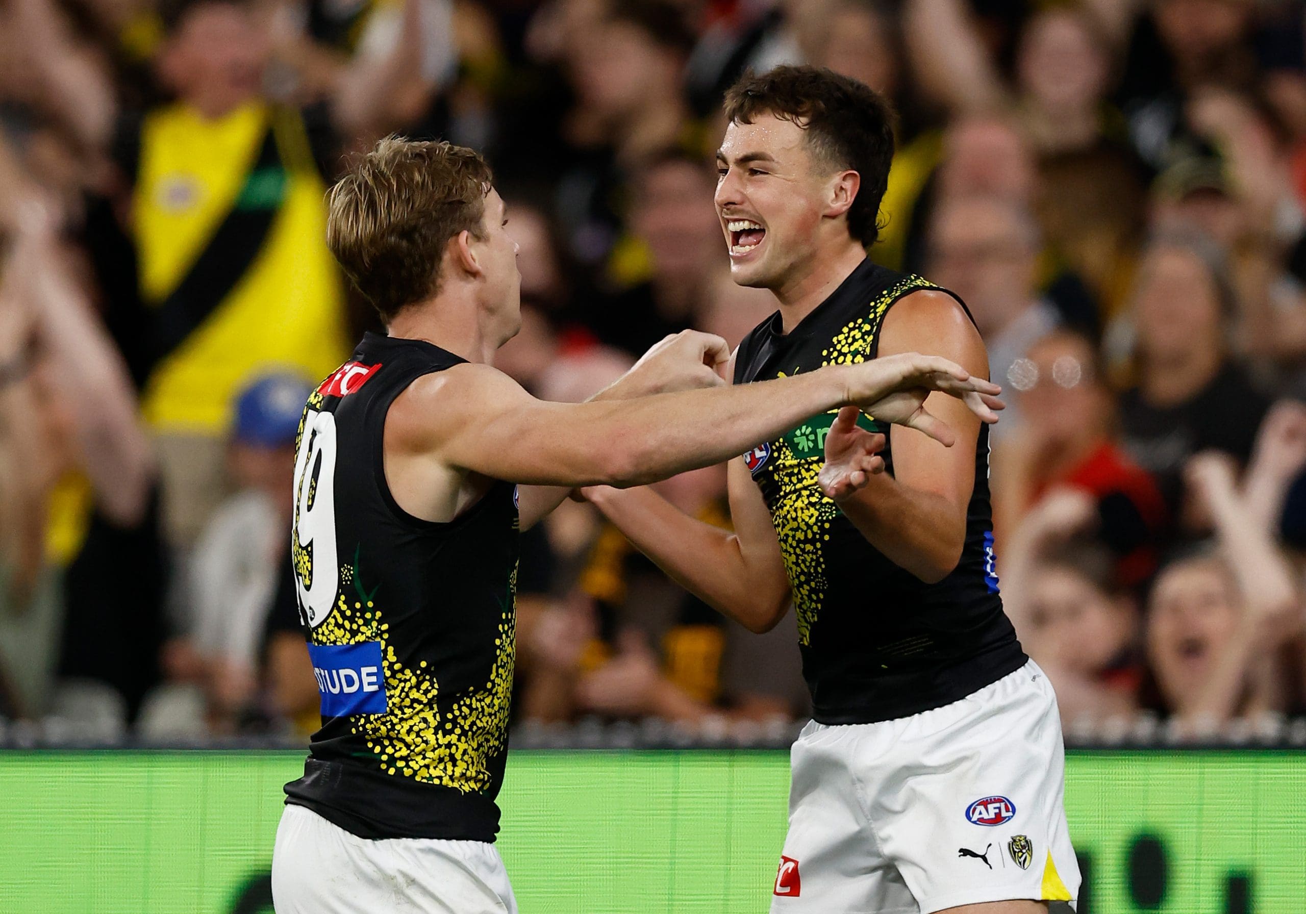 MELBOURNE, AUSTRALIA - APRIL 24: Tom Lynch (left) and Steely Green of the Tigers celebrate during the 2025 AFL Round 07 match between the Melbourne Demons and the Richmond Tigers at the Melbourne Cricket Ground on April 24, 2025 in Melbourne, Australia. (Photo by Michael Willson/AFL Photos via Getty Images)