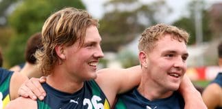 MELBOURNE, AUSTRALIA - APRIL 27: Oliver Greeves and Koby Evans of the AFL National Academy celebrate winning the Marsh AFL National Academy Boys match between Australia U18 and Coburg VFL at Whitten Oval on April 27, 2025 in Melbourne, Australia. (Photo by Josh Chadwick/AFL Photos/via Getty Images)