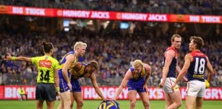 PERTH, AUSTRALIA - MAY 03: Team mates check on Jeremy McGovern of the Eagles after a collision with Harrison Petty of the Demons during the round eight AFL match between West Coast Eagles and Melbourne Demons at Optus Stadium, on May 03, 2025, in Perth, Australia. (Photo by Paul Kane/Getty Images)