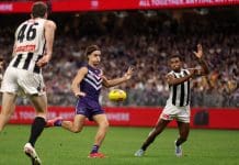 PERTH, AUSTRALIA - MAY 08: Murphy Reid of the Dockers kicks the ball during the 2025 AFL Round 09 match between the Fremantle Dockers and the Collingwood Magpies at Optus Stadium on May 8, 2025 in Perth, Australia. (Photo by Janelle St Pierre/AFL Photos via Getty Images)