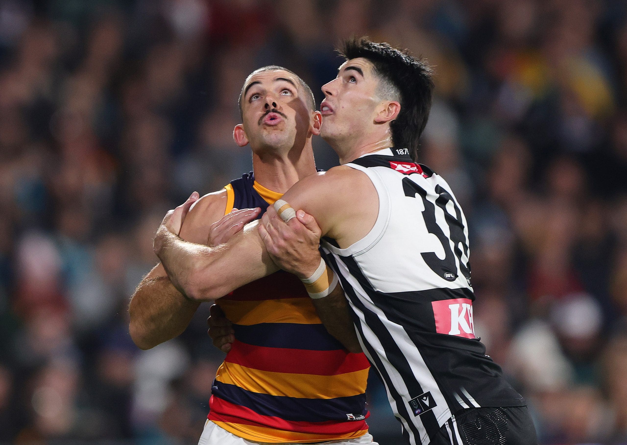 ADELAIDE, AUSTRALIA - MAY 10: Taylor Walker of the Crows and Dante Visentini of the Power during the 2025 AFL Round 09 match between the Port Adelaide Power and the Adelaide Crows at Adelaide Oval on May 10, 2025 in Adelaide, Australia. (Photo by Sarah Reed/AFL Photos via Getty Images)