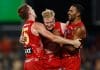 DARWIN, AUSTRALIA - MAY 10: (L-R) Noah Anderson, John Noble and Touk Miller of the Suns celebrate during the 2025 AFL Round 09 match between the Gold Coast Suns and the Western Bulldogs at TIO Stadium on May 10, 2025 in Darwin, Australia. (Photo by Michael Willson/AFL Photos via Getty Images)