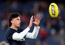 MELBOURNE, AUSTRALIA - MAY 09: Elijah Hollands of the Blues warms up ahead of the round nine AFL match between St Kilda Saints and Carlton Blues at Melbourne Cricket Ground, on May 09, 2025, in Melbourne, Australia. (Photo by Josh Chadwick/AFL Photos/Getty Images)