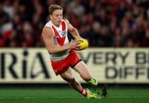 MELBOURNE, AUSTRALIA - MAY 10: Isaac Heeney of the Swans falls over whilst running with the ball during the round nine AFL match between Essendon Bombers and Sydney Swans at Marvel Stadium, on May 10, 2025, in Melbourne, Australia. (Photo by Morgan Hancock/Getty Images)