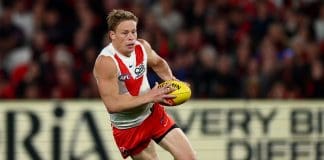 MELBOURNE, AUSTRALIA - MAY 10: Isaac Heeney of the Swans falls over whilst running with the ball during the round nine AFL match between Essendon Bombers and Sydney Swans at Marvel Stadium, on May 10, 2025, in Melbourne, Australia. (Photo by Morgan Hancock/Getty Images)