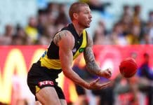 MELBOURNE, AUSTRALIA - MAY 11: Nathan Broad of the Tigers handballs during the round nine AFL match between Richmond Tigers and West Coast Eagles at Melbourne Cricket Ground, on May 11, 2025, in Melbourne, Australia. (Photo by Morgan Hancock/AFL Photos/via Getty Images)