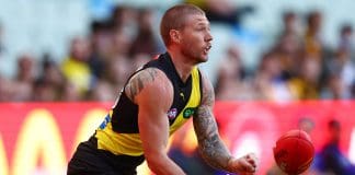 MELBOURNE, AUSTRALIA - MAY 11: Nathan Broad of the Tigers handballs during the round nine AFL match between Richmond Tigers and West Coast Eagles at Melbourne Cricket Ground, on May 11, 2025, in Melbourne, Australia. (Photo by Morgan Hancock/AFL Photos/via Getty Images)