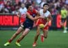 MELBOURNE, AUSTRALIA - MAY 25: Harvey Langford of the Demons tackles Sam Wicks of the Swans during the round 11 AFL match between Narrm (Melbourne Demons) and Sydney Swans at Melbourne Cricket Ground, on May 25, 2025, in Melbourne, Australia. (Photo by Quinn Rooney/Getty Images)