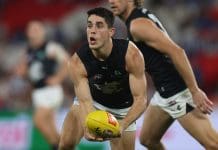 MELBOURNE, AUSTRALIA - APRIL 18: Adam Cerra of the Blues handballs during the round six AFL match between North Melbourne Kangaroos and Carlton Blues at Marvel Stadium, on April 18, 2025, in Melbourne, Australia. (Photo by Daniel Pockett/Getty Images)