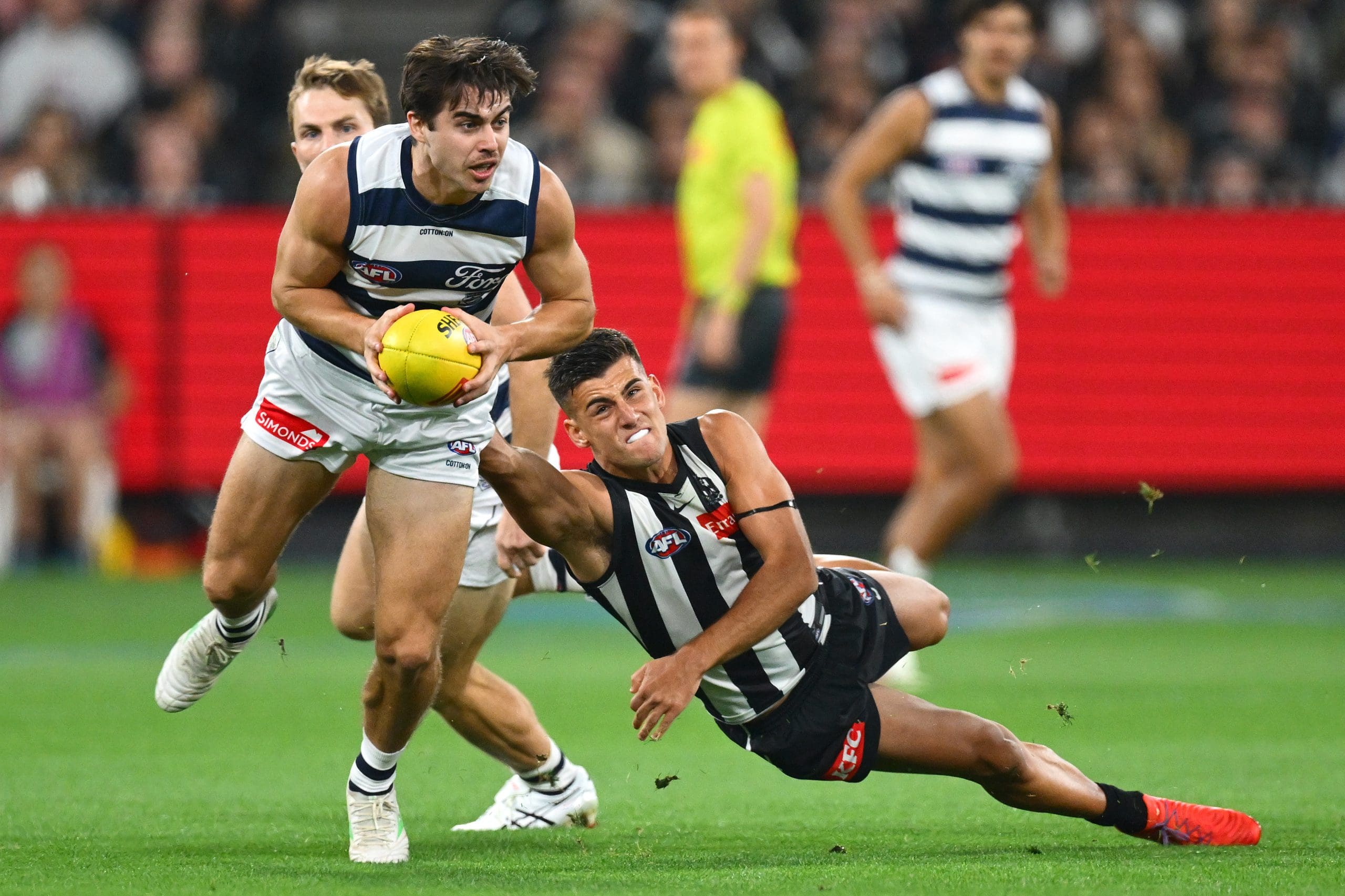 MELBOURNE, AUSTRALIA - MAY 03: Oisin Mullin of the Cats is tackled by Nick Daicos of the Magpies during the round eight AFL match between Collingwood Magpies and Geelong Cats at Melbourne Cricket Ground, on May 03, 2025, in Melbourne, Australia. (Photo by Quinn Rooney/Getty Images)