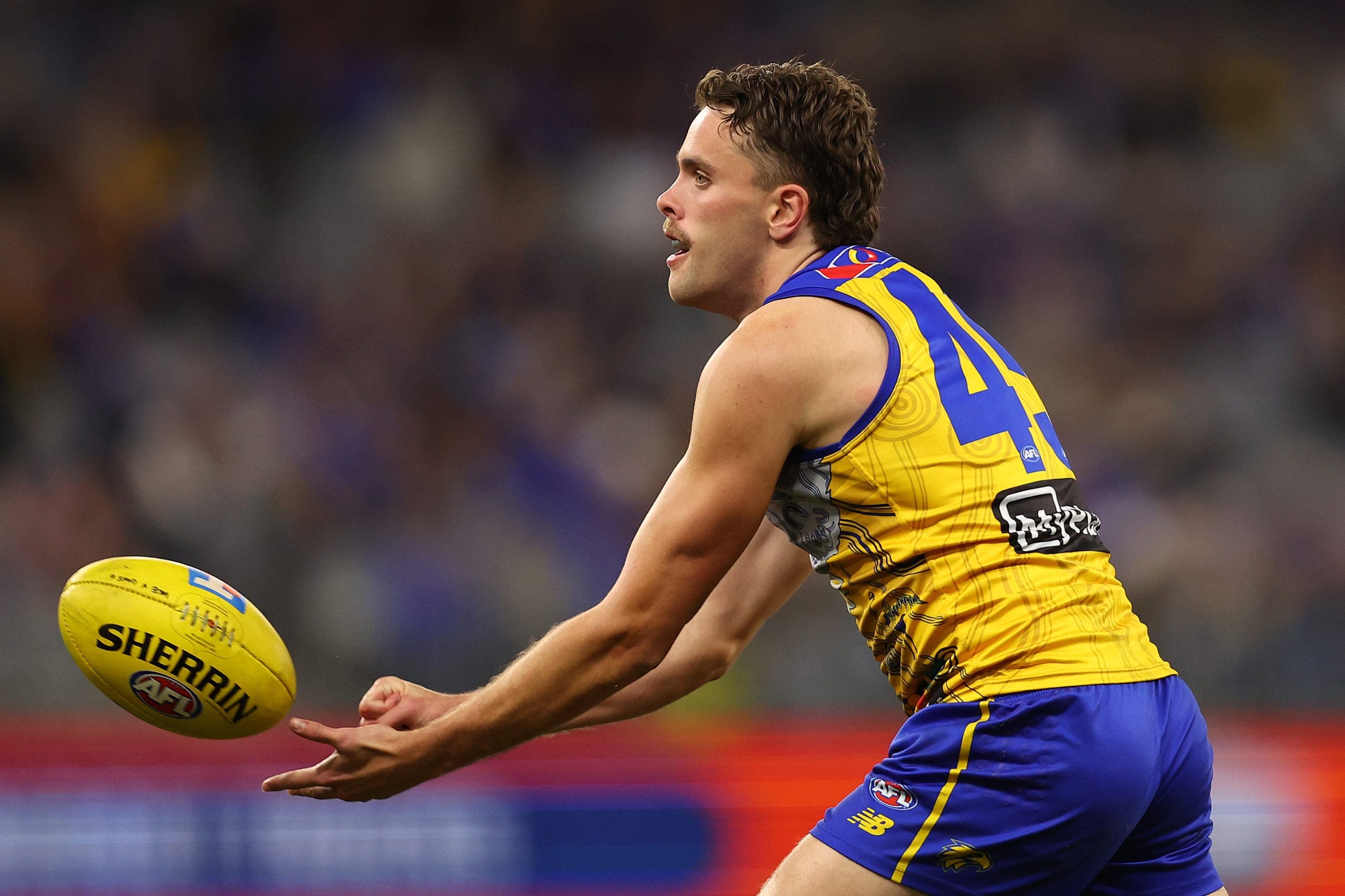 PERTH, AUSTRALIA - JULY 04: Tom McCarthy of the Eagles handballs during the round 17 AFL match between West Coast Eagles and GWS Giants at Optus Stadium on July 04, 2025 in Perth, Australia. (Photo by Paul Kane/Getty Images)