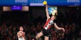 MELBOURNE, AUSTRALIA - JULY 13: First gamer Max Heath of the Saints wins a hit out during the round 18 AFL match between St Kilda Saints and Sydney Swans at Marvel Stadium on July 13, 2025 in Melbourne, Australia. (Photo by Morgan Hancock/Getty Images)