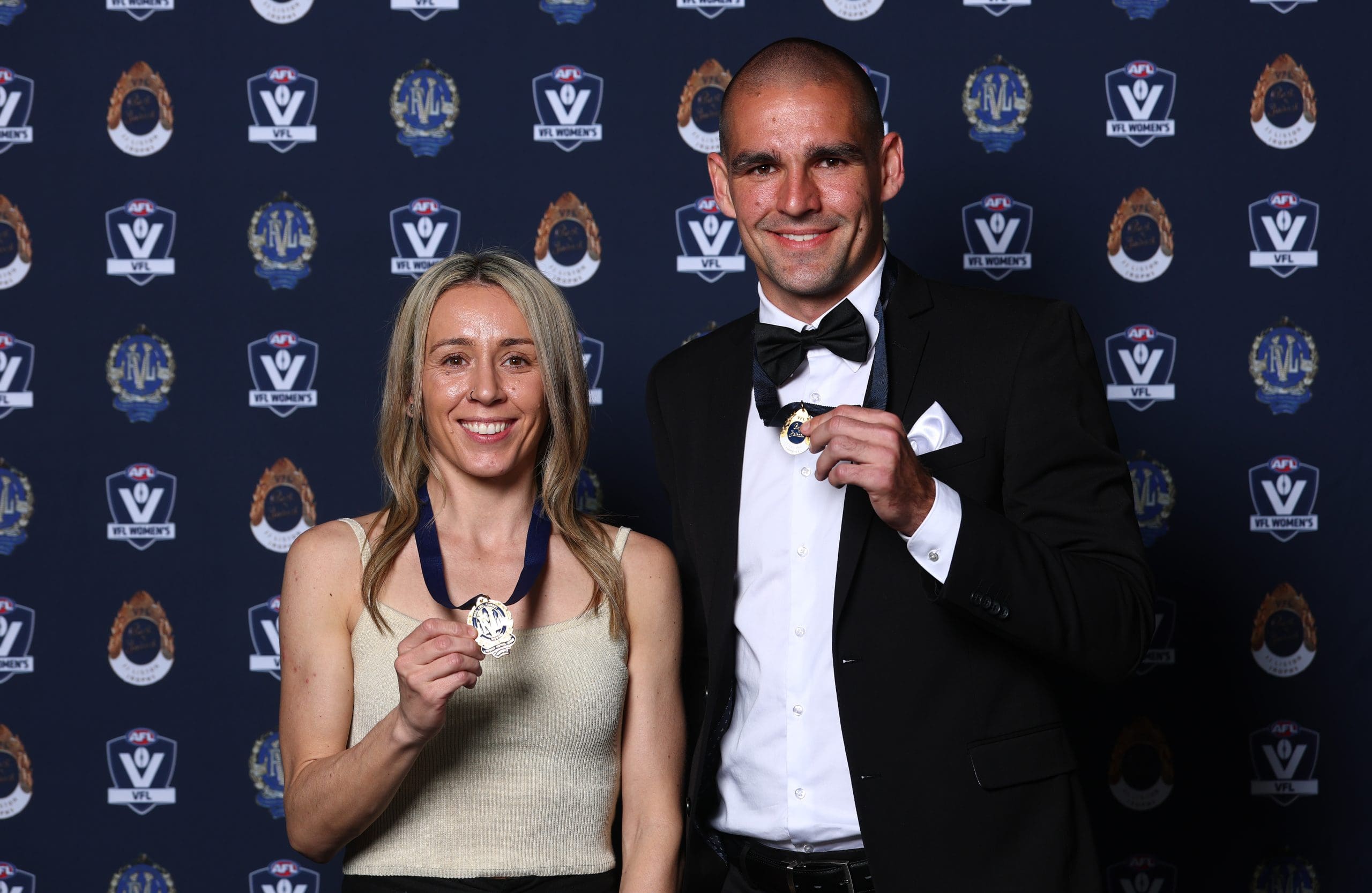 MELBOURNE, AUSTRALIA - SEPTEMBER 15: Ange Gogos of the Darebin Falcons, winner of the 2025 Lambert-Pearce Medal for the VFLW Best and Fairest and Jacob Dawson of the Southport Sharks, winner of the 2025 J.J. Liston Trophy for the VFL Best and Fairest pose during the 2025 VFL and VFLW Awards at the Victory Room, Marvel Stadium on September 15th, 2025 in Melbourne, Australia. (Photo by Josh Chadwick/AFL Photos)