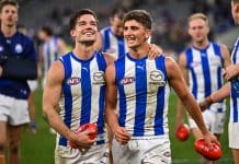 PERTH, AUSTRALIA - JUNE 08: Jy Simpkin and Harry Sheezel of the Kangaroos are happy with the win during the 2024 AFL Round 12 match between the West Coast Eagles and the North Melbourne Kangaroos at Optus Stadium on June 08, 2024 in Perth, Australia. (Photo by Daniel Carson/AFL Photos via Getty Images)