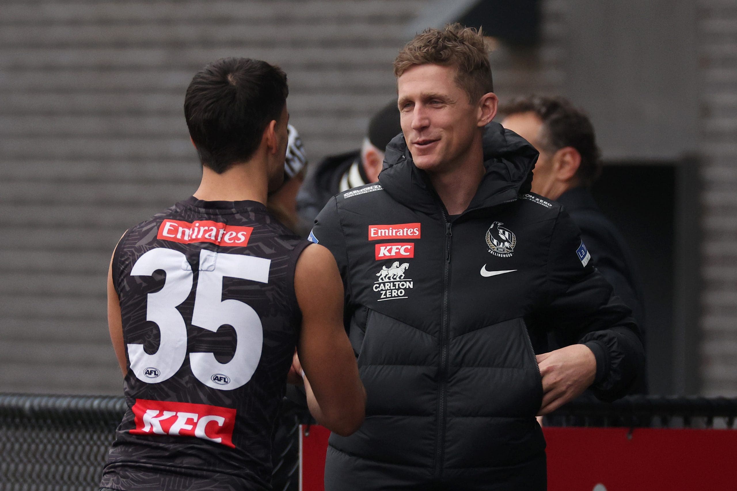 MELBOURNE, AUSTRALIA - JULY 31: Scott Selwood, Magpies assistant coach (R), chats with Nick Daicos of the Magpies during a Collingwood Magpies AFL training session at Olympic Park Oval on July 31, 2024 in Melbourne, Australia. (Photo by Daniel Pockett/Getty Images)