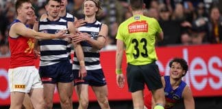 MELBOURNE, AUSTRALIA - SEPTEMBER 05: Cam Rayner of the Lions gets a free kick fro Zach Guthrie of the Cats during the AFL Second Qualifying Final match between the Geelong Cats and the Brisbane Lions at the Melbourne Cricket Ground on September 05, 2025 in Melbourne, Australia. (Photo by James Wiltshire/AFL Photos via Getty Images)