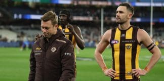MELBOURNE, AUSTRALIA - SEPTEMBER 19: A disapointed Sam Mitchell walks from the ground after the AFL Preliminary Final match between Geelong Cats and Hawthorn Hawks at Melbourne Cricket Ground on September 19, 2025 in Melbourne, Australia. (Photo by Robert Cianflone/Getty Images)