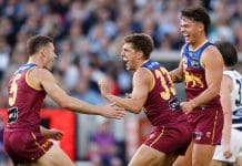 MELBOURNE, AUSTRALIA - SEPTEMBER 27: (L-R) Josh Dunkley, Zac Bailey and Cam Rayner of the Lions celebrate during the AFL Grand Final match between the Geelong Cats and the Brisbane Lions at the Melbourne Cricket Ground on September 27, 2025 in Melbourne, Australia. (Photo by Michael Willson/AFL Photos via Getty Images)