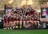 MELBOURNE, AUSTRALIA - SEPTEMBER 27: The Lions celebrate on the dais after winning the AFL Grand Final match between the Geelong Cats and the Brisbane Lions at the Melbourne Cricket Ground on September 27, 2025 in Melbourne, Australia. (Photo by Michael Willson/AFL Photos via Getty Images)