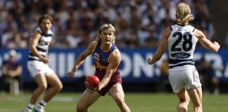 MELBOURNE, AUSTRALIA - SEPTEMBER 27: Will Ashcroft of the Lions handballs during the AFL Grand Final match between Geelong Cats and Brisbane Lions at Melbourne Cricket Ground on September 27, 2025 in Melbourne, Australia. (Photo by Darrian Traynor/Getty Images)
