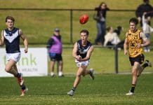 PERTH, AUSTRALIA - JULY 06: Thomas Burton of Victoria Metro handballs during the Marsh AFL National Championships U18 Boys match between Western Australia and Victoria Metro at The Good Grocer Park, on July 06, 2025, in Perth, Australia. (Photo by Stefan Gosatti/AFL Photos/via Getty Images)