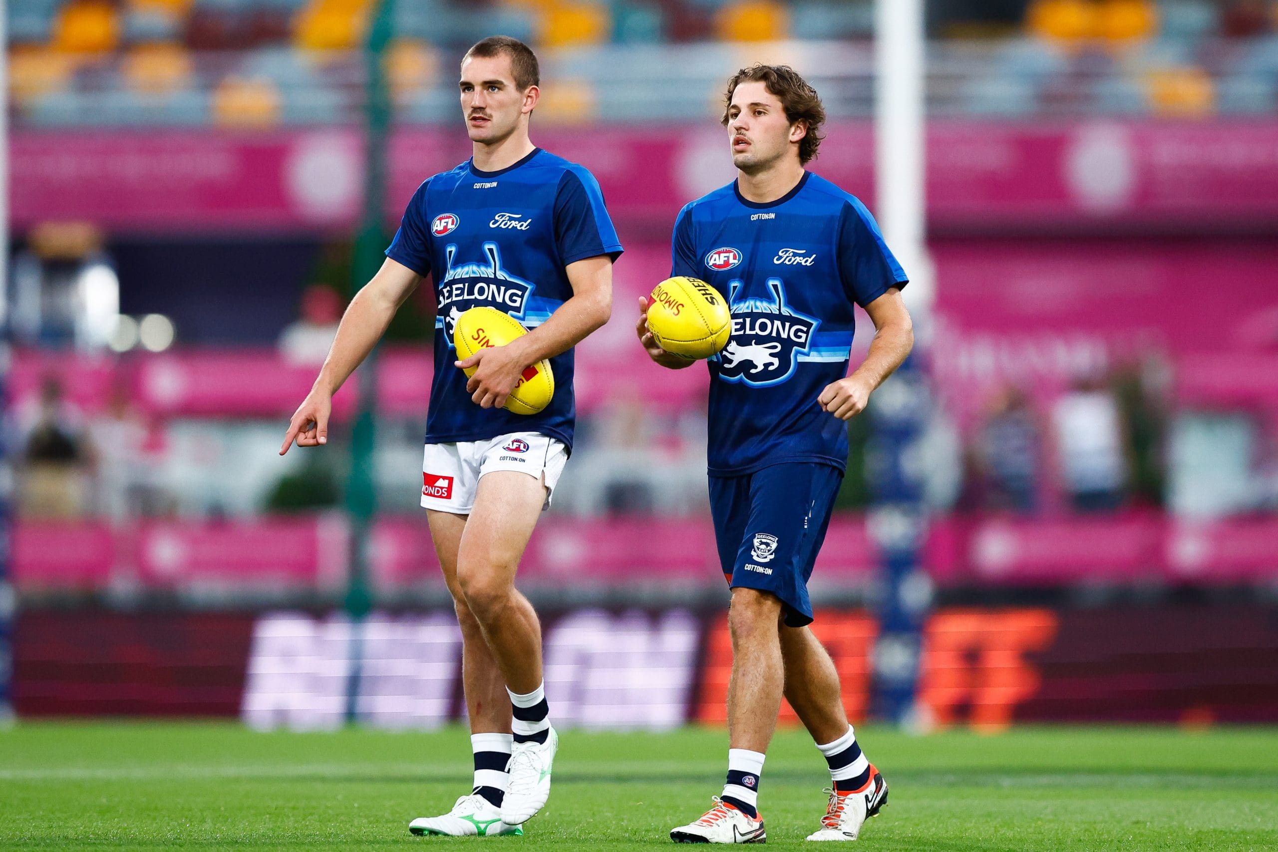 BRISBANE, AUSTRALIA - MARCH 29: Ted Clohesy and Jhye Clark of the Cats are seen prior to the 2025 AFL Round 03 match between the Brisbane Lions and the Geelong Cats at The Gabba on March 29, 2025 in Brisbane, Australia. (Photo by Russell Freeman/AFL Photos via Getty Images)