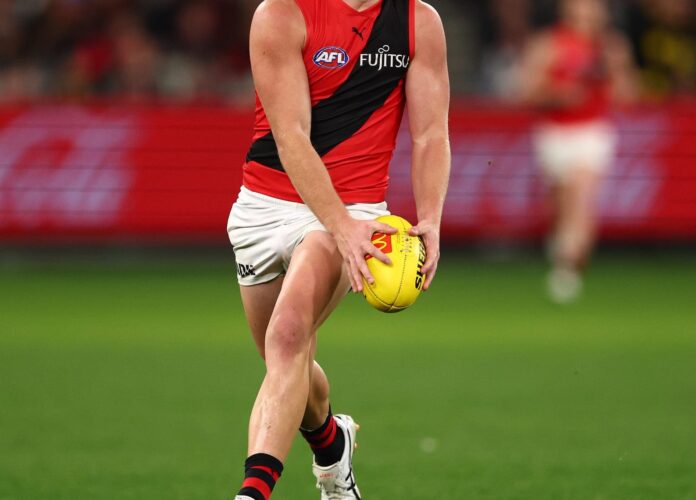 MELBOURNE, AUSTRALIA - JULY 12: Oskar Smartt of the Bombers runs with the ball during the round 18 AFL match between Richmond Tigers and Essendon Bombers at Melbourne Cricket Ground on July 12, 2025 in Melbourne, Australia. (Photo by Morgan Hancock/Getty Images)