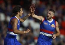 MELBOURNE, AUSTRALIA - MARCH 30: Jamarra Ugle-Hagan of the Bulldogs (L) celebrates with Marcus Bontempelli of the Bulldogs after kicking a goal during the round three AFL match between Western Bulldogs and Brisbane Lions at Marvel Stadium, on March 30, 2023, in Melbourne, Australia. (Photo by Daniel Pockett/Getty Images)