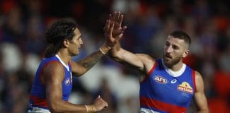 MELBOURNE, AUSTRALIA - MARCH 30: Jamarra Ugle-Hagan of the Bulldogs (L) celebrates with Marcus Bontempelli of the Bulldogs after kicking a goal during the round three AFL match between Western Bulldogs and Brisbane Lions at Marvel Stadium, on March 30, 2023, in Melbourne, Australia. (Photo by Daniel Pockett/Getty Images)